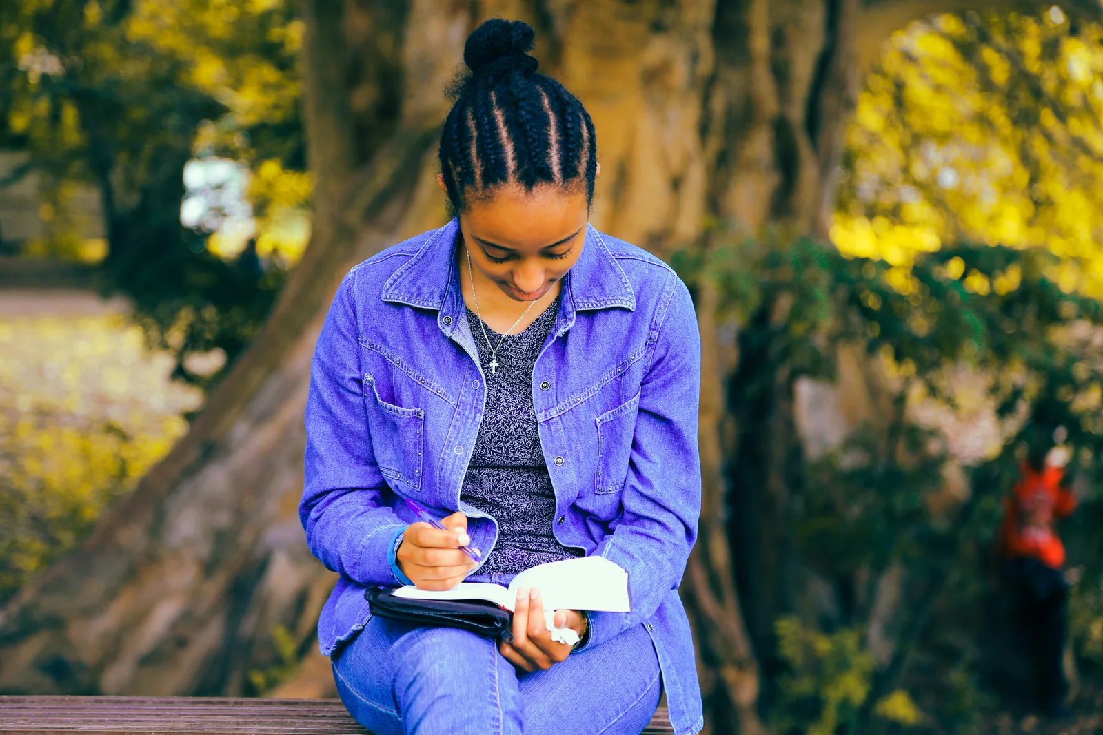 woman writing in journal